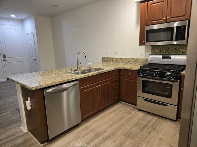 a kitchen with a stove and a microwave