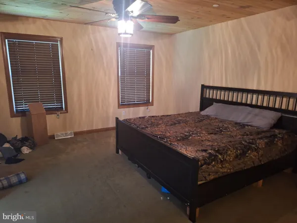 a bed sitting in a room next to a window