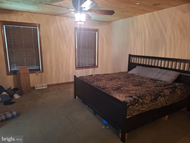 a bed sitting in a room next to a window