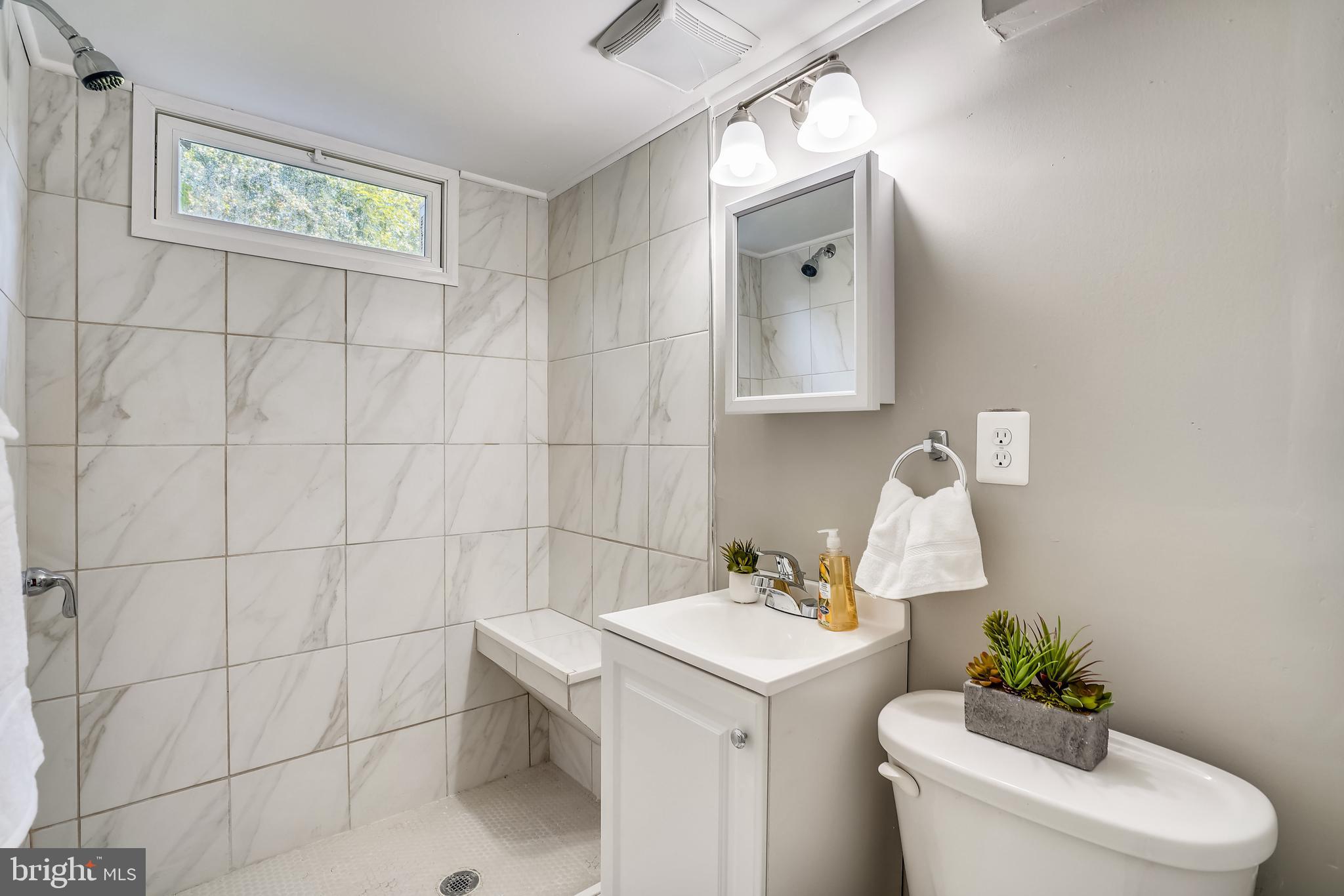 905 Kerwin Road Silver Spring, MD 20901 - Photo 23 of 47 Bathroom #2 with tiled shower and a bench!