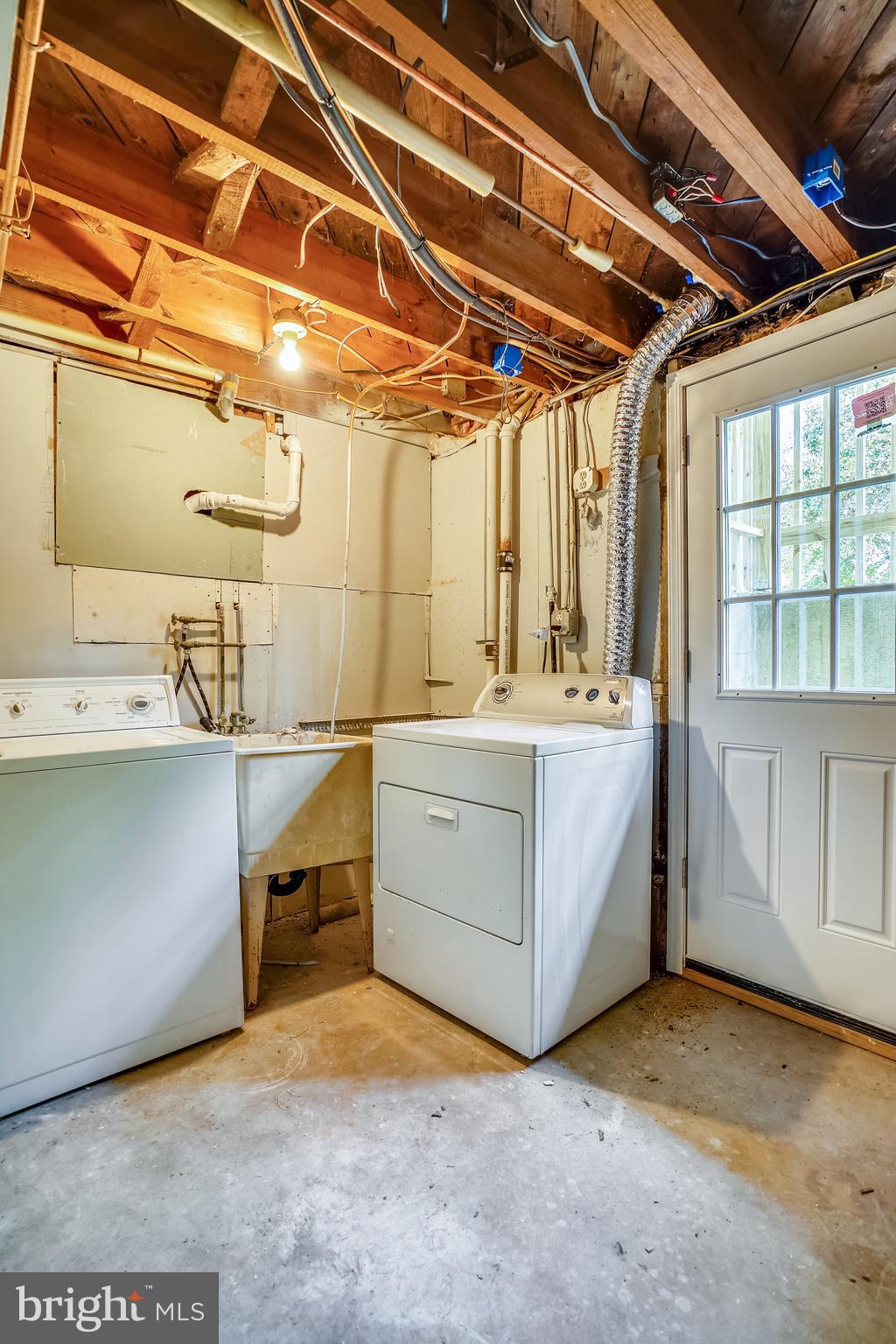 905 Kerwin Road Silver Spring, MD 20901 - Photo 24 of 47 Utility room laundry machines and outdoor access