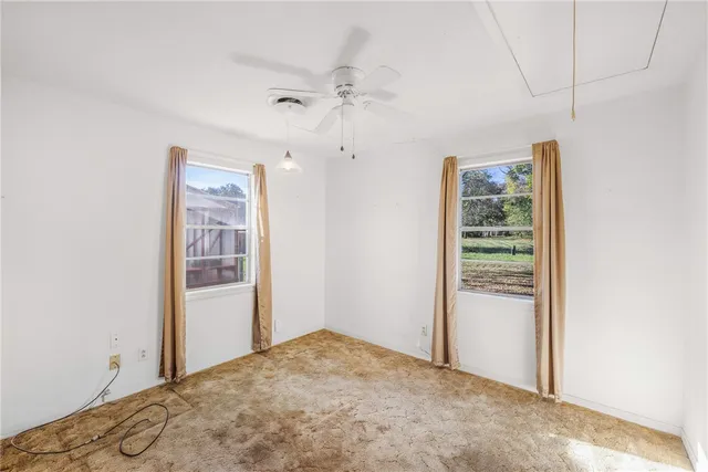 an empty room with windows