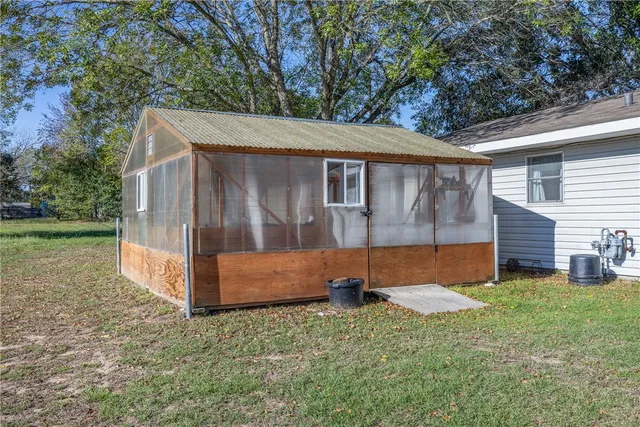 a view of backyard with a garden and yard