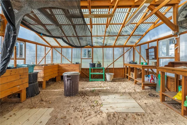 a view of a storage room with wooden floor