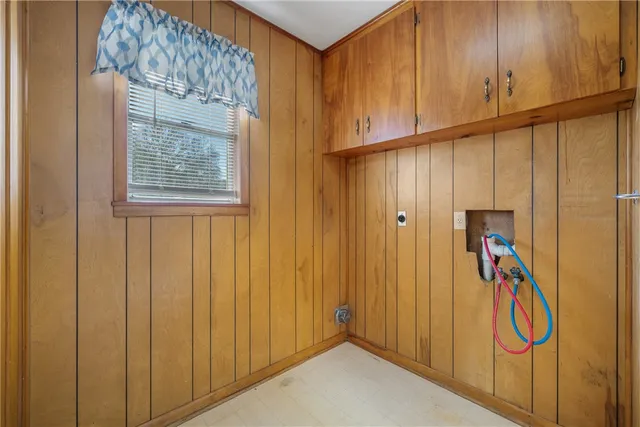 a view of a garage with wooden walls