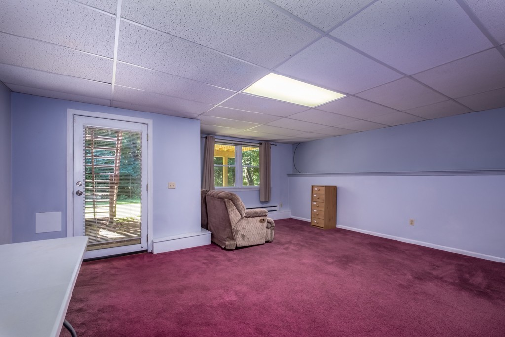 27 Highfield Road, Unit D Charlton, MA 01507 - Photo 20 of 28 an empty room with windows