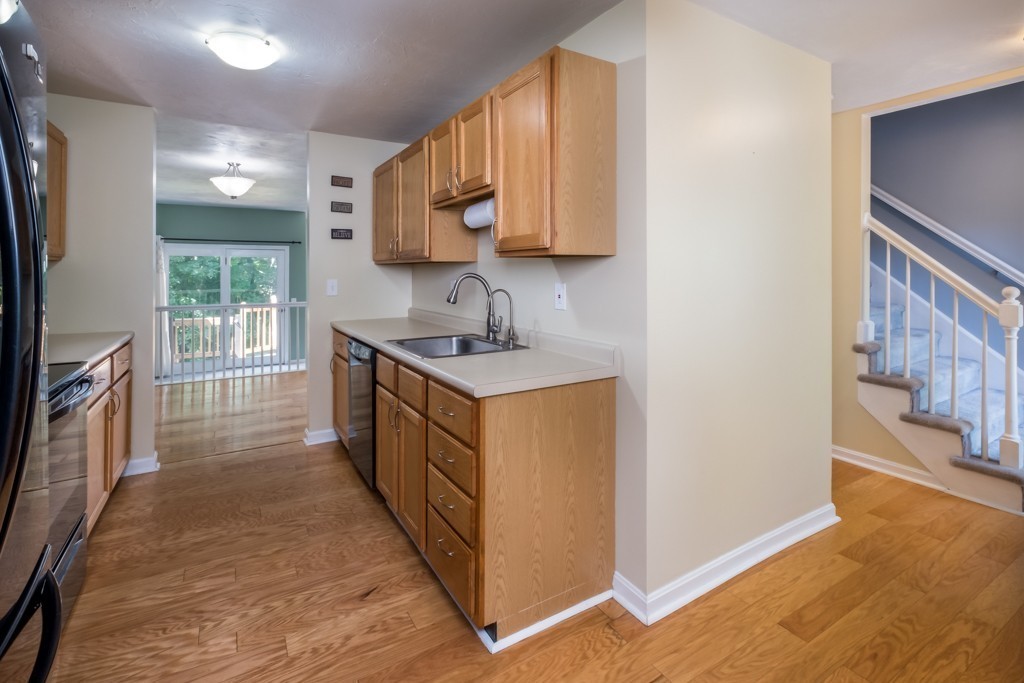 27 Highfield Road, Unit D Charlton, MA 01507 - Photo 6 of 28 a kitchen with stainless steel appliances granite countertop a stove and a sink