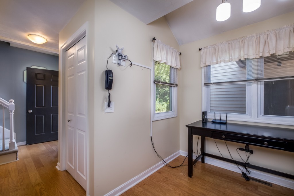 27 Highfield Road, Unit D Charlton, MA 01507 - Photo 8 of 28 a room that has a bed and a table in it