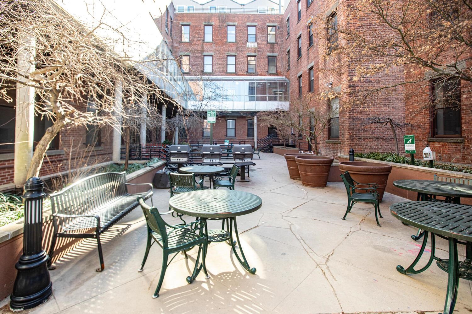 341 Monmouth Street, Unit 203D Jersey City, NJ 07302 - Photo 21 of 23 a view of a patio with a table and chairs