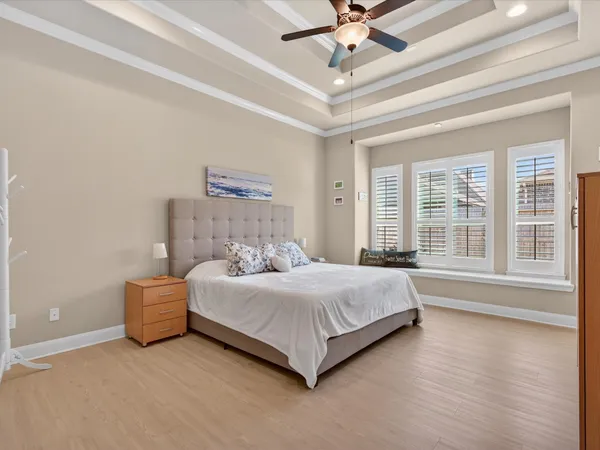 a bedroom with a large bed and a large window