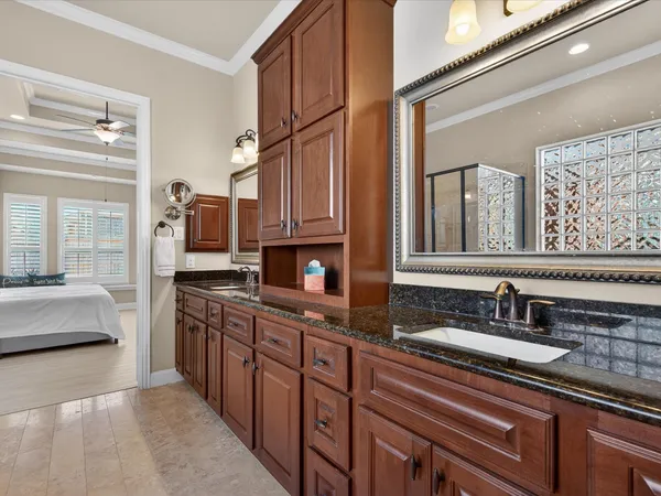 a kitchen with stainless steel appliances granite countertop a sink stove and cabinets