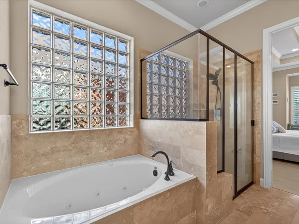 a bathroom with a bathtub and a shower