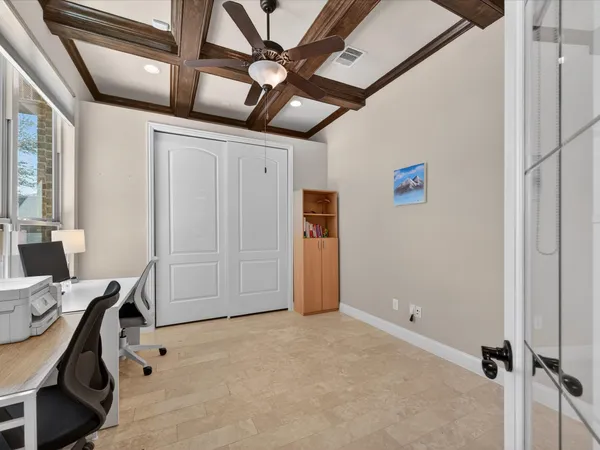 a view of a livingroom with furniture and natural light