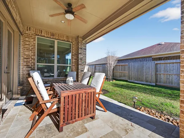 a patio with table and chairs
