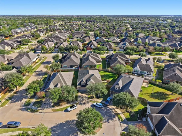 an aerial view of a house with a garden