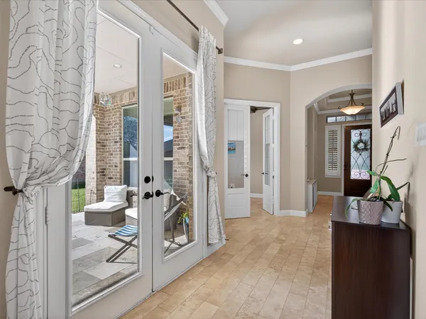 a view of a balcony with wooden floor and furniture
