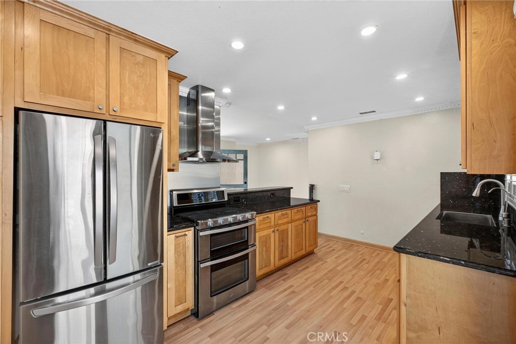 2519 Ralston Lane Redondo Beach, CA 90278 - Photo 14 of 69 a kitchen with stainless steel appliances a refrigerator sink and stove