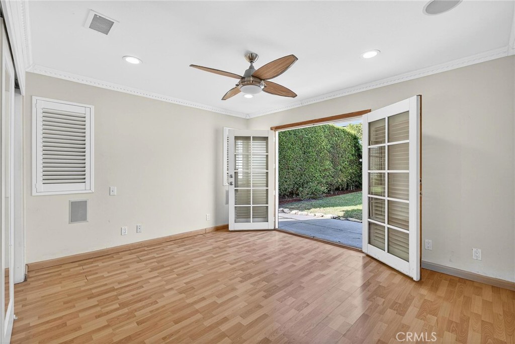 2519 Ralston Lane Redondo Beach, CA 90278 - Photo 19 of 69 a view of empty room with wooden floor and fan