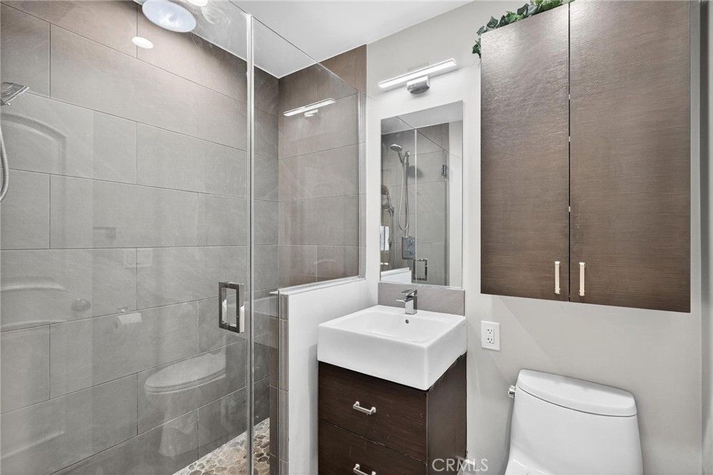 2519 Ralston Lane Redondo Beach, CA 90278 - Photo 25 of 69 a bathroom with a toilet sink shower and mirror