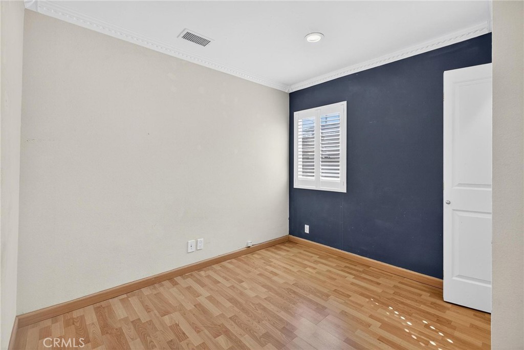 2519 Ralston Lane Redondo Beach, CA 90278 - Photo 27 of 69 a view of an empty room with wooden floor and a window