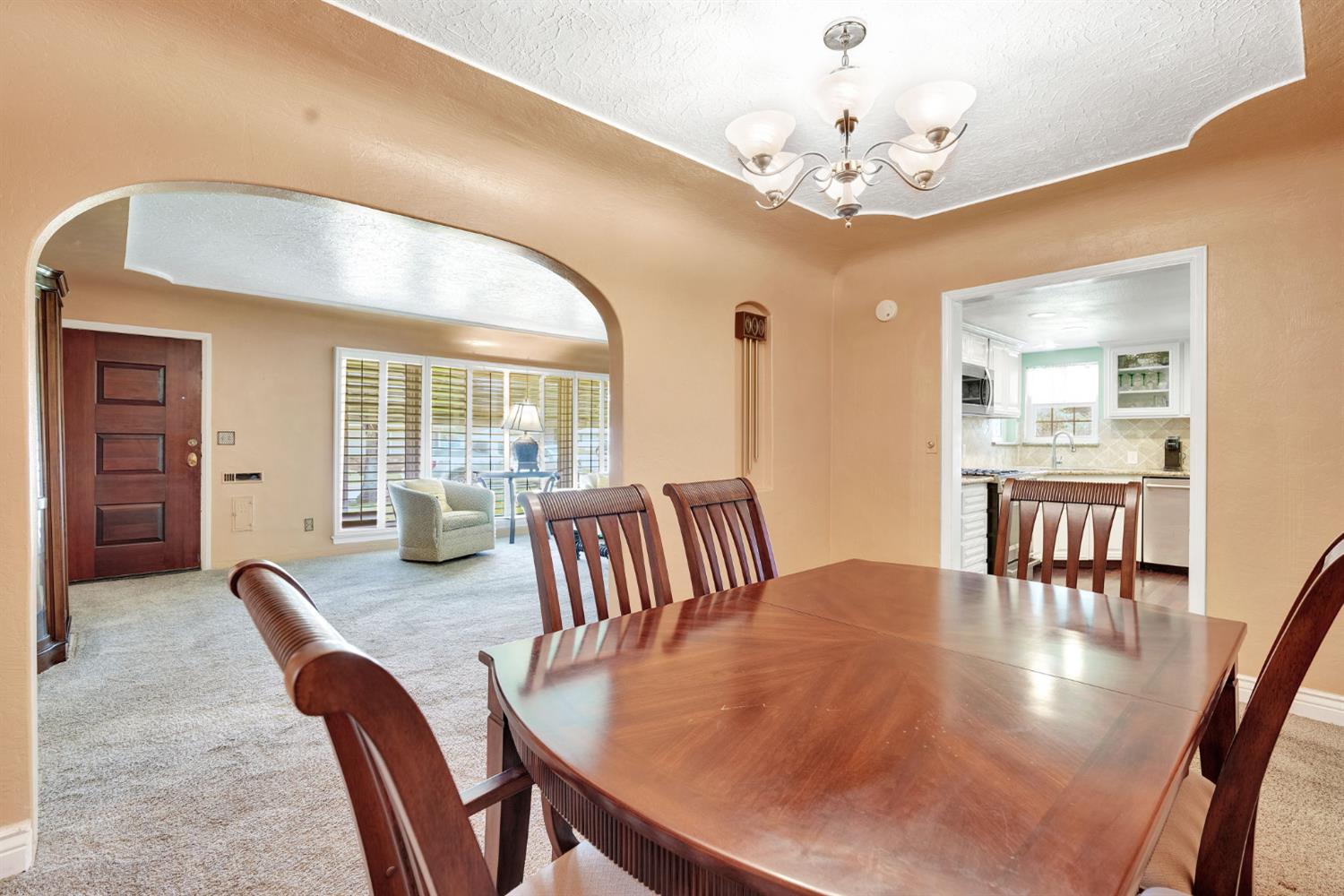200 Lyons Street Madera, CA 93638 - Photo 13 of 32 a view of a dining room with furniture window and wooden floor