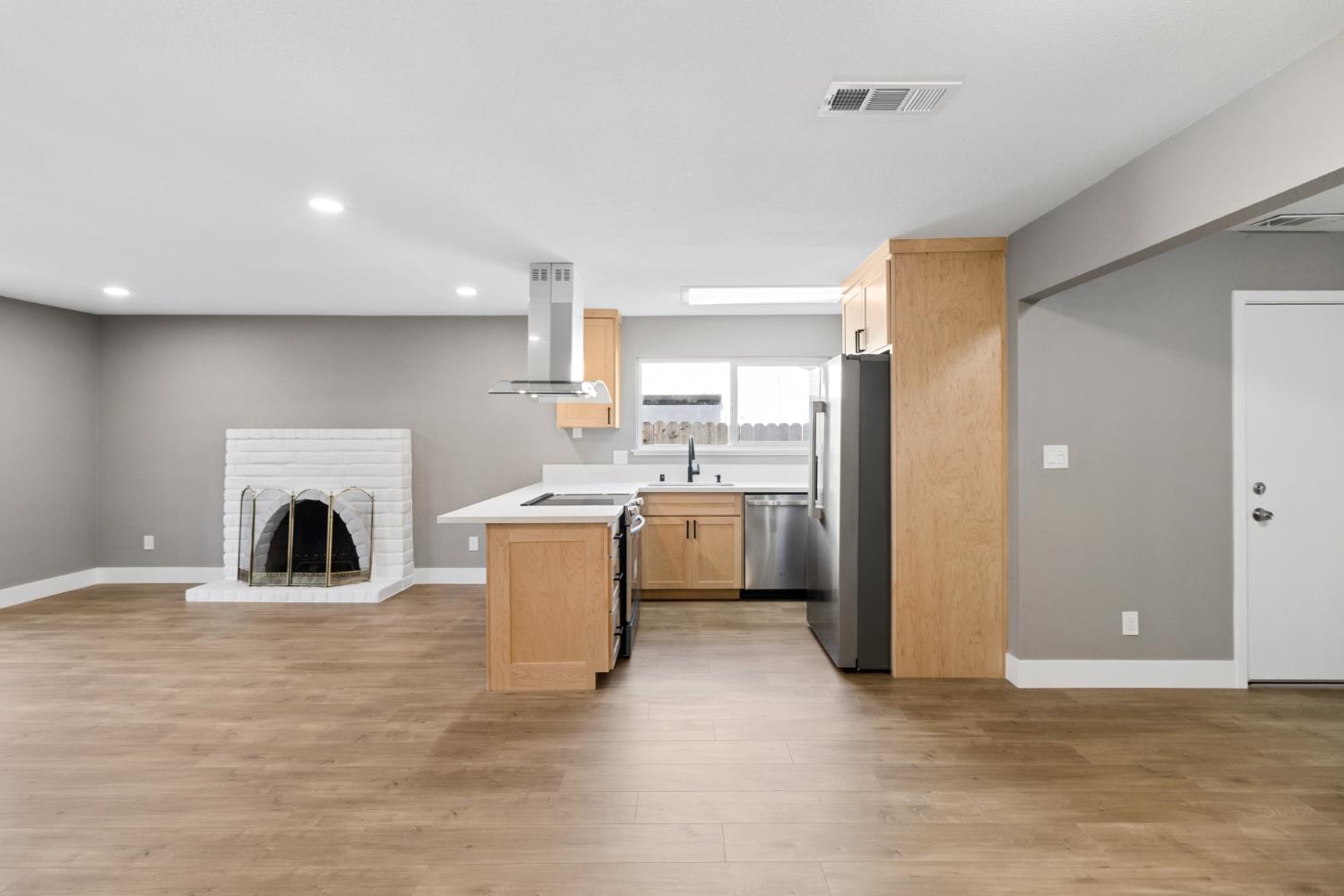 7249 Windjammer Way Citrus Heights, CA 95621 - Photo 14 of 41 a view of a kitchen with a sink a fireplace and a window