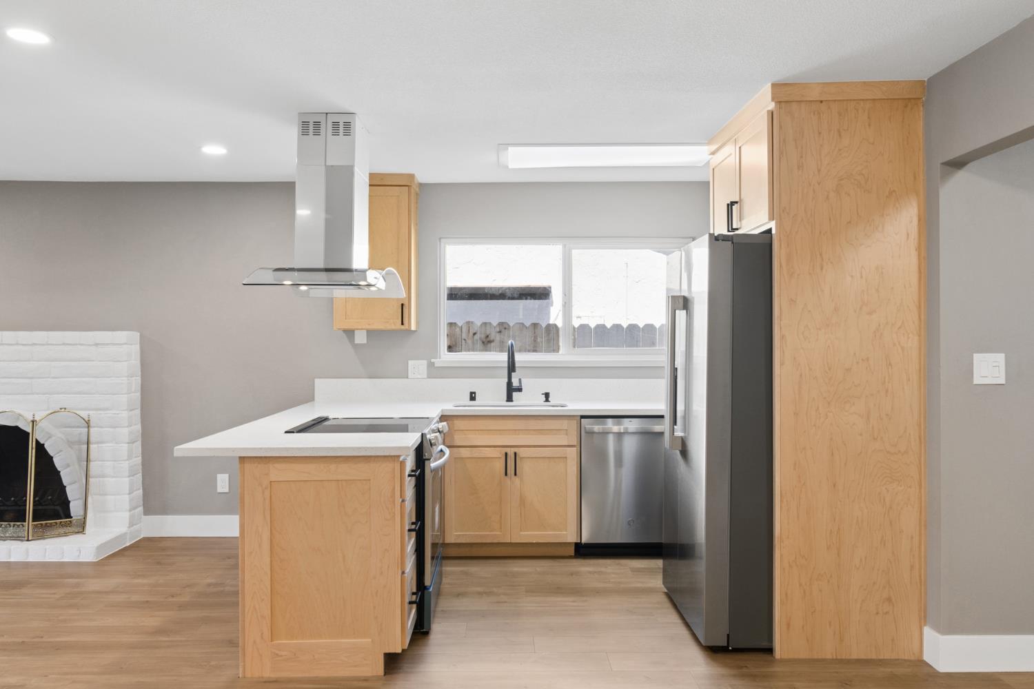 7249 Windjammer Way Citrus Heights, CA 95621 - Photo 15 of 41 a kitchen with a refrigerator a sink and a stove top oven
