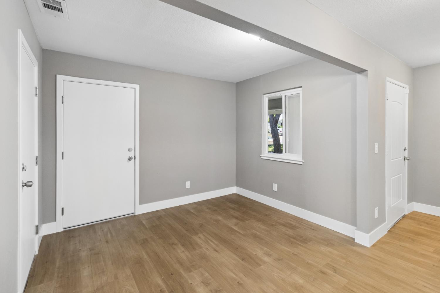 7249 Windjammer Way Citrus Heights, CA 95621 - Photo 19 of 41 an empty room with wooden floor and windows