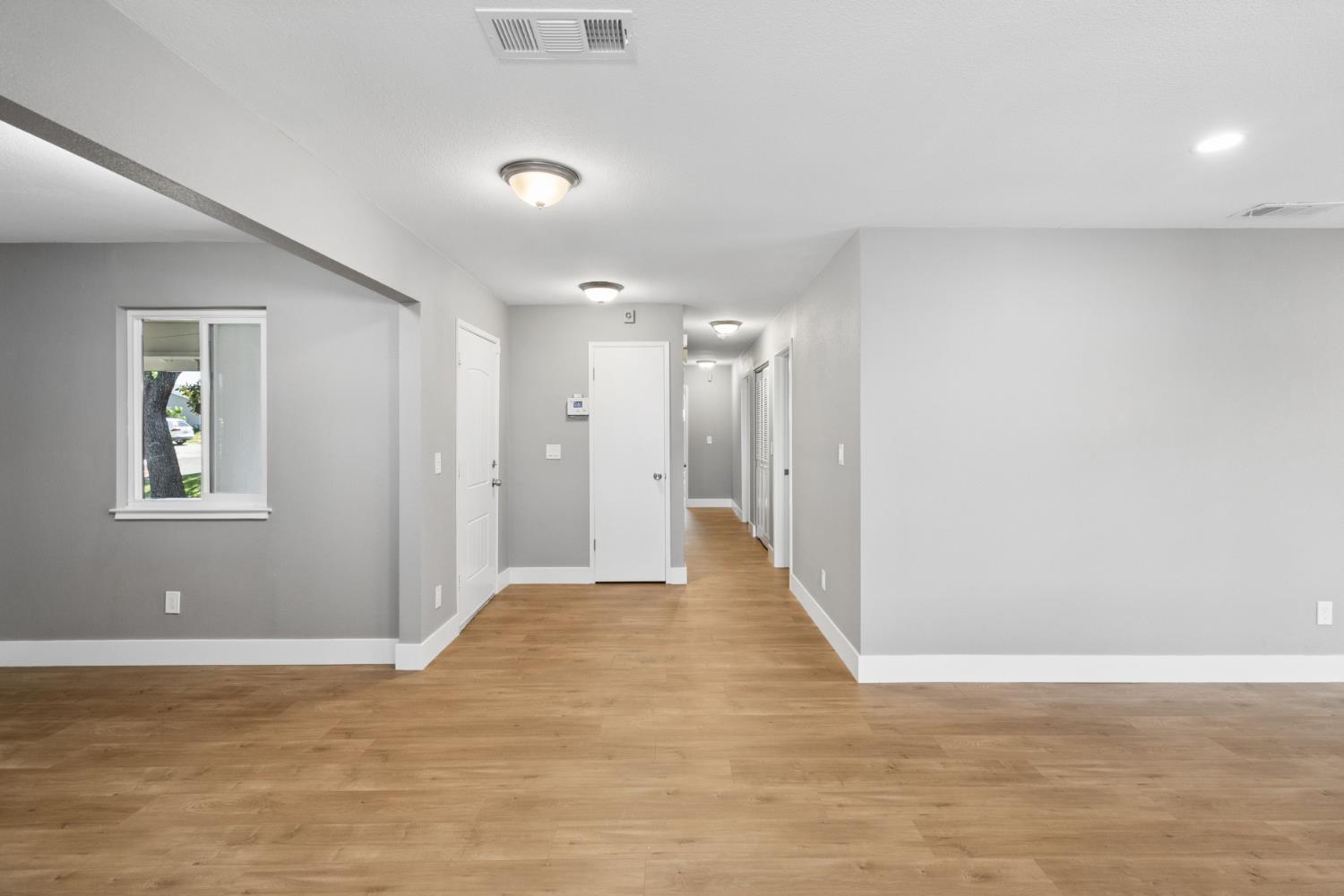 7249 Windjammer Way Citrus Heights, CA 95621 - Photo 20 of 41 a view of a big room with wooden floor and windows