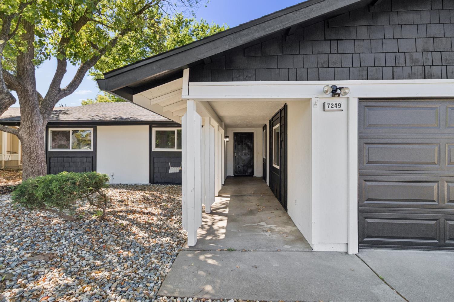7249 Windjammer Way Citrus Heights, CA 95621 - Photo 2 of 41 a view of a house with a tree and wooden fence