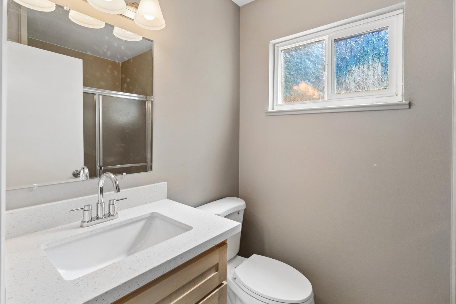 7249 Windjammer Way Citrus Heights, CA 95621 - Photo 24 of 41 a bathroom with a sink vanity mirror and toilet
