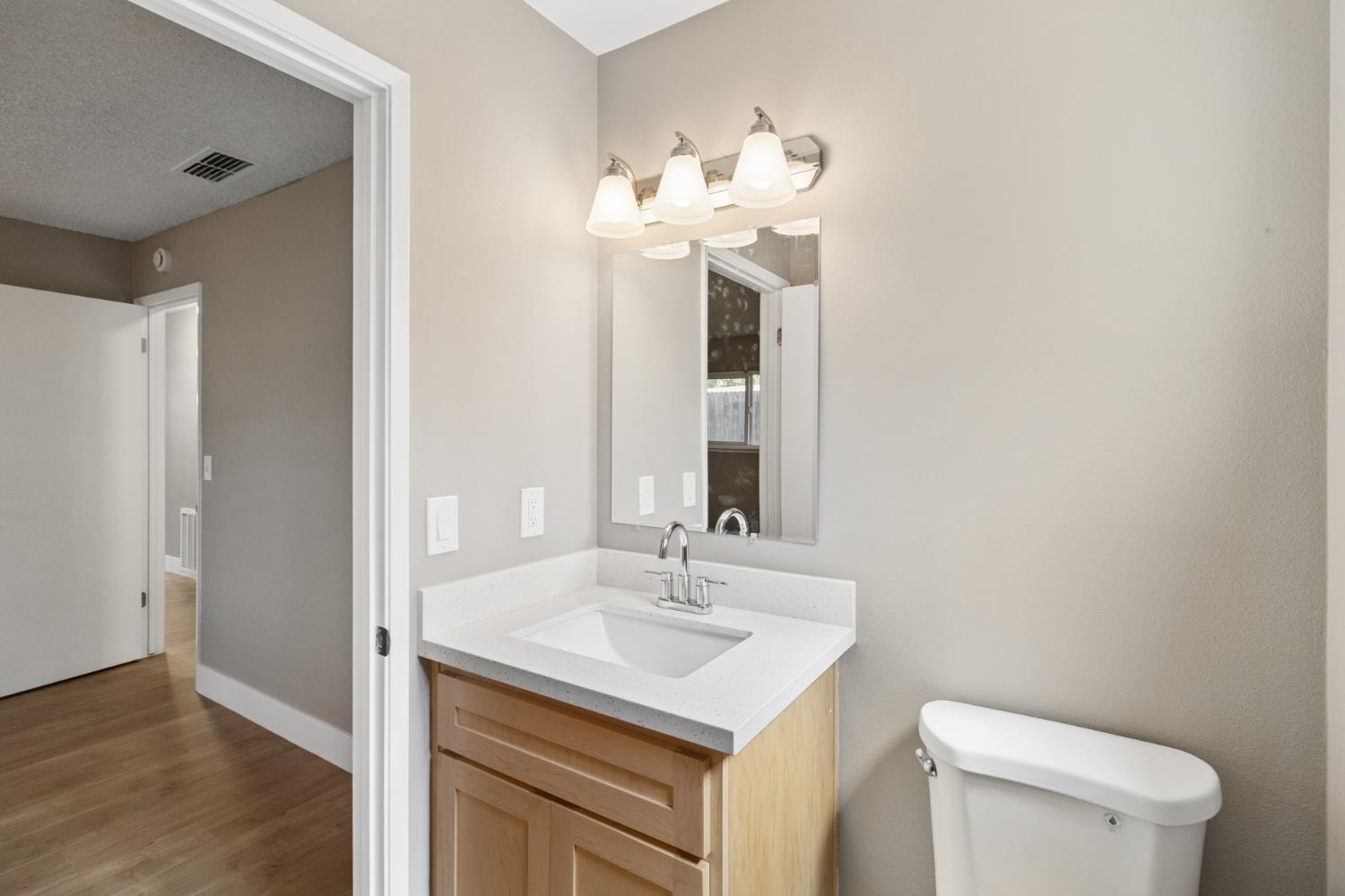 7249 Windjammer Way Citrus Heights, CA 95621 - Photo 26 of 41 a bathroom with a sink vanity and a toilet