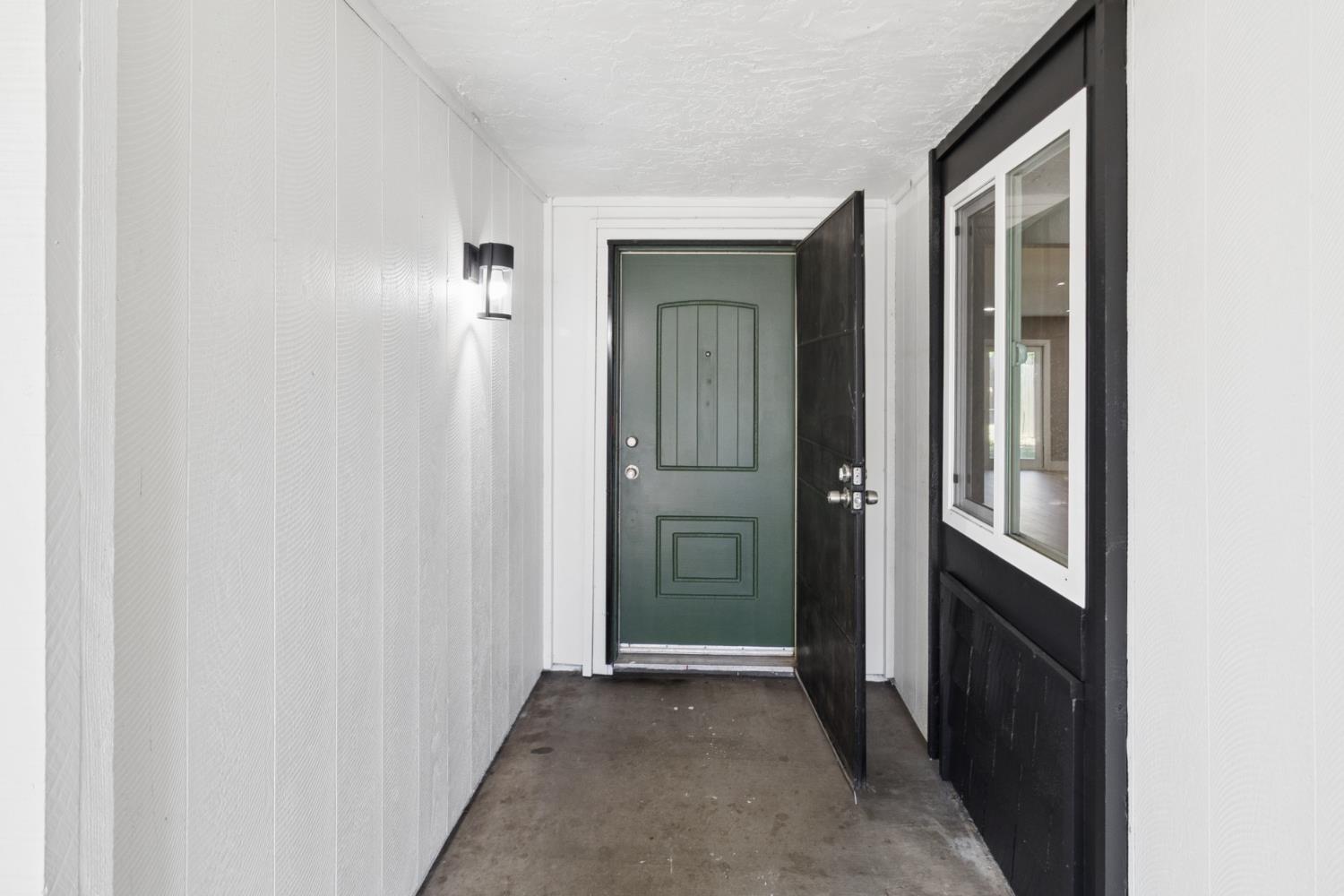 7249 Windjammer Way Citrus Heights, CA 95621 - Photo 3 of 41 a view of a hallway with wooden floor