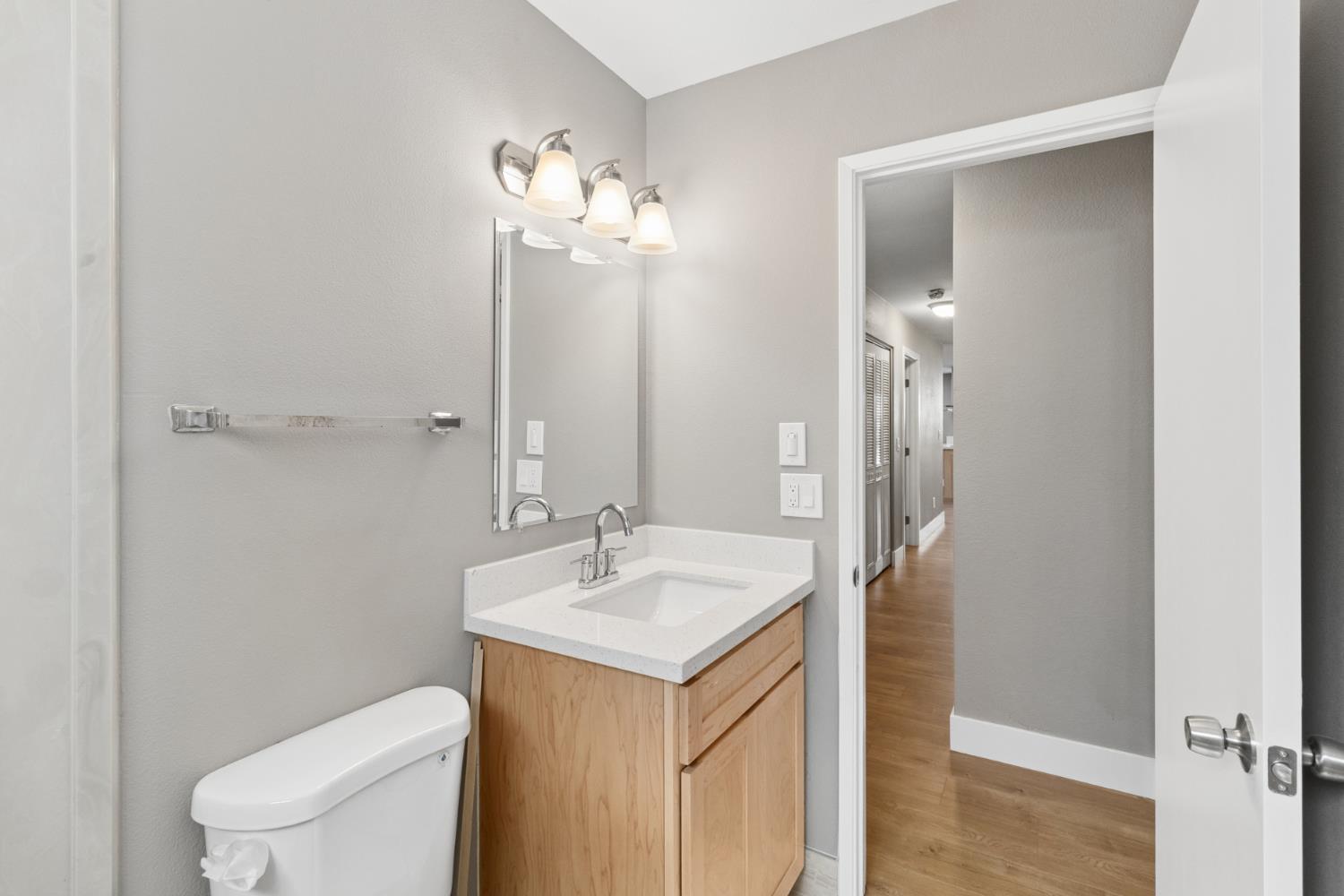 7249 Windjammer Way Citrus Heights, CA 95621 - Photo 33 of 41 a bathroom with a toilet sink and mirror