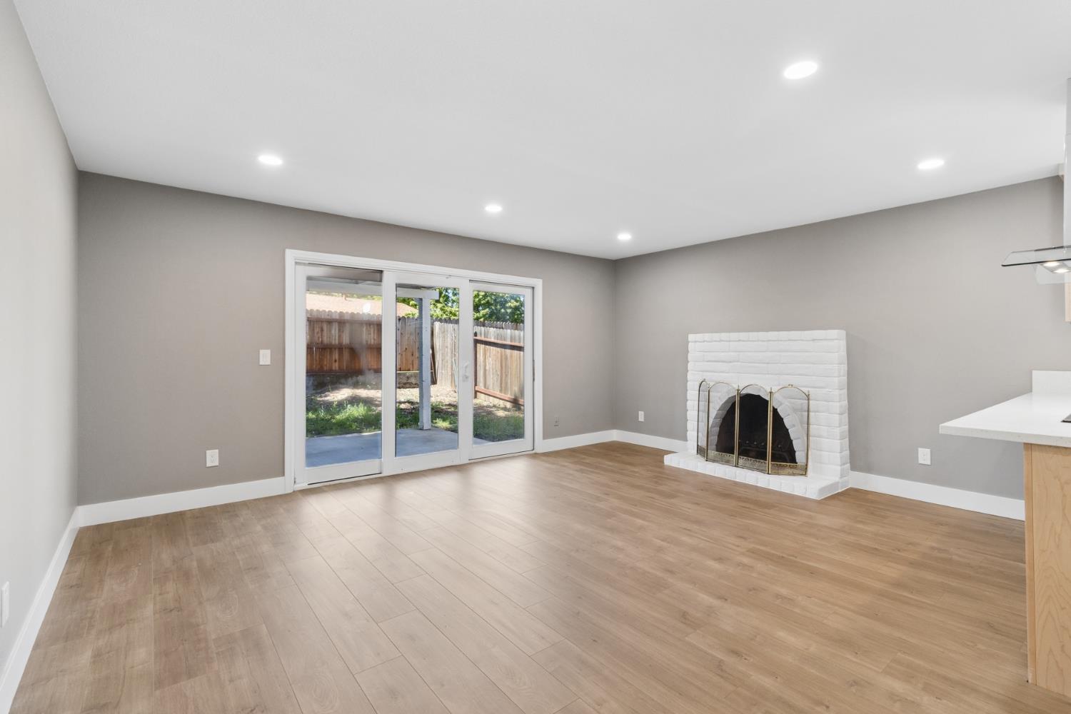 7249 Windjammer Way Citrus Heights, CA 95621 - Photo 6 of 41 a view of an empty room with wooden floor and a window