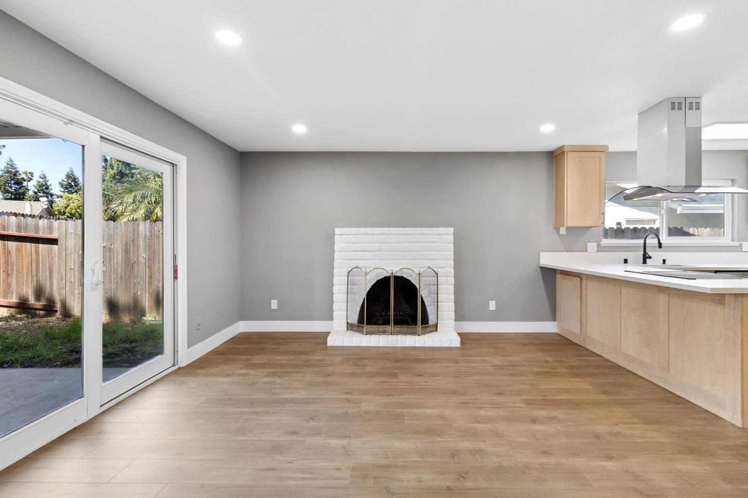 7249 Windjammer Way Citrus Heights, CA 95621 - Photo 7 of 41 a view of a kitchen with a sink and a fireplace