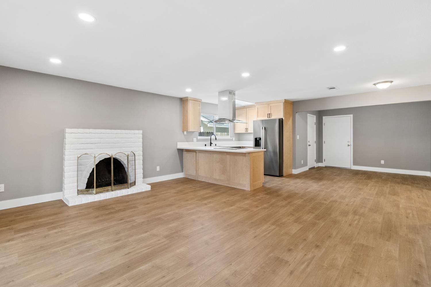 7249 Windjammer Way Citrus Heights, CA 95621 - Photo 8 of 41 a view of a kitchen with a sink and a fireplace