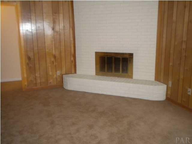 6541 Oakcliff Road Pensacola, FL 32526 - Photo 6 of 17 Family Room With Brick Fireplace With a Hearth