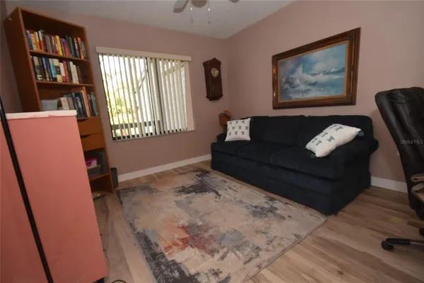 a living room with furniture and a window