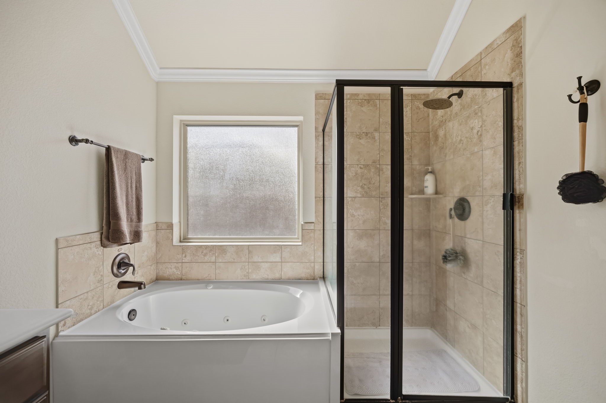 24118 McKinzie Ridge Drive Porter, TX 77365 - Photo 21 of 25 a bathroom with a bathtub and a shower