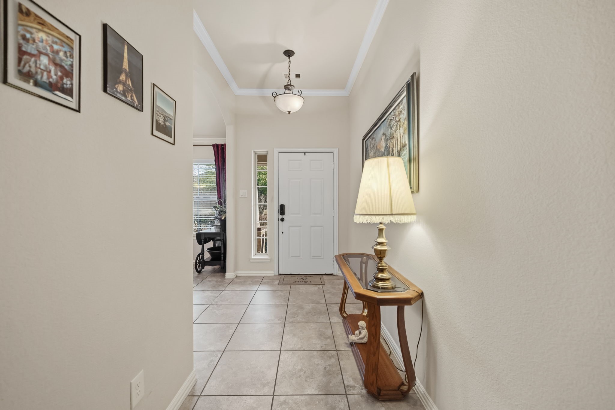 24118 McKinzie Ridge Drive Porter, TX 77365 - Photo 3 of 25 a room with chandelier fan and wooden floor