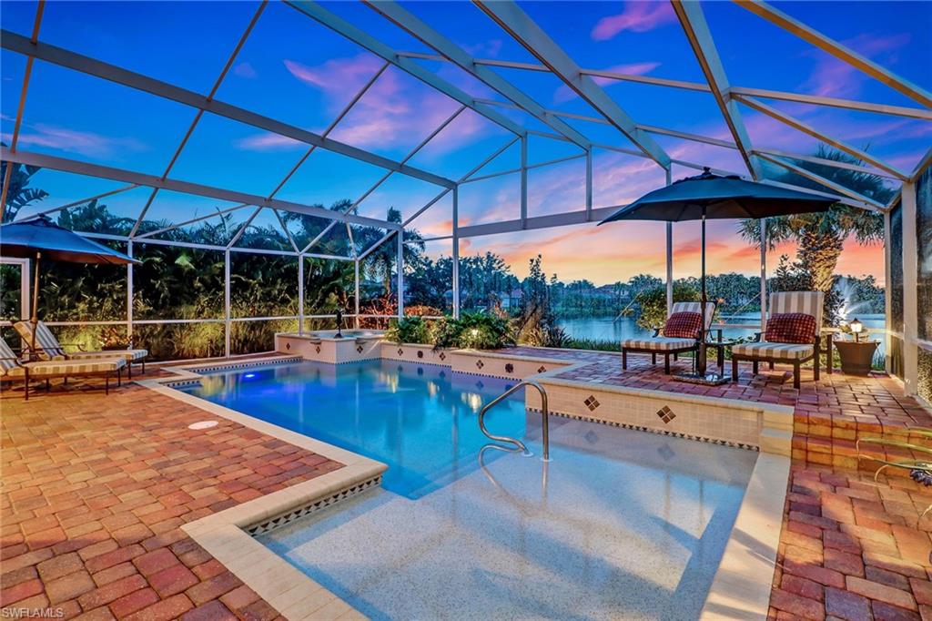 19731 Villa Rosa Loop Estero, FL 33967 - Photo 1 of 27 a view of a swimming pool with chairs in patio