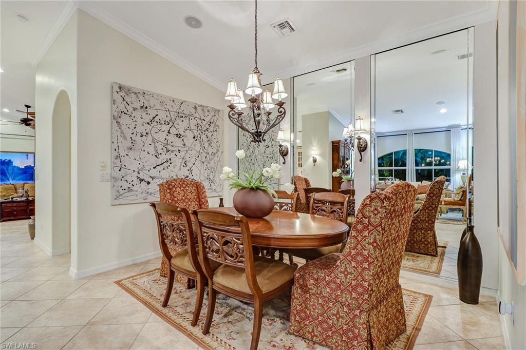 19731 Villa Rosa Loop Estero, FL 33967 - Photo 12 of 27 a view of a dining room with furniture and chandelier
