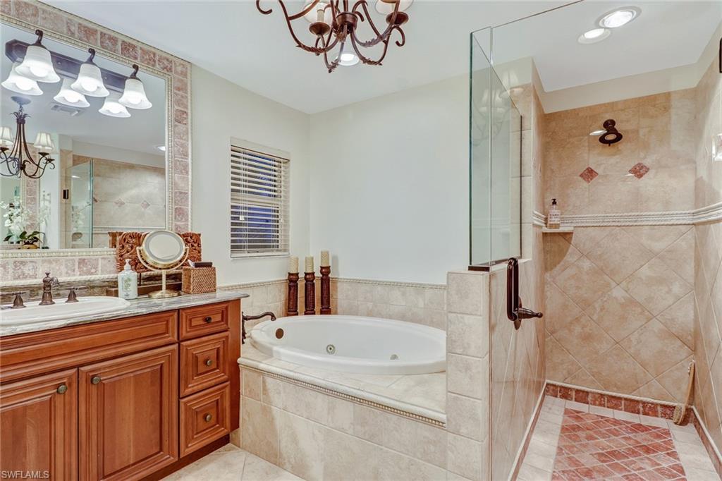 19731 Villa Rosa Loop Estero, FL 33967 - Photo 18 of 27 a bathroom with a tub sink and mirror