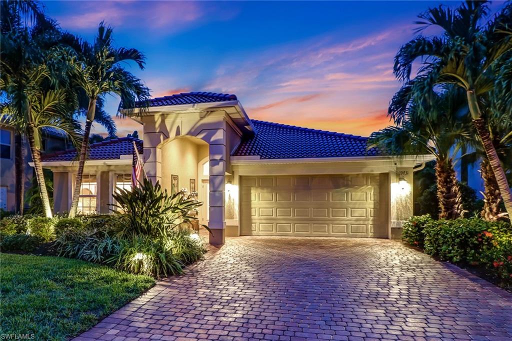 19731 Villa Rosa Loop Estero, FL 33967 - Photo 2 of 27 a front view of a house with garden