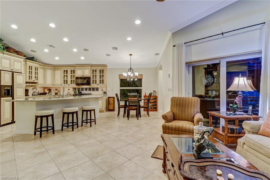 19731 Villa Rosa Loop Estero, FL 33967 - Photo 8 of 27 a living room with stainless steel appliances lots of furniture and kitchen view