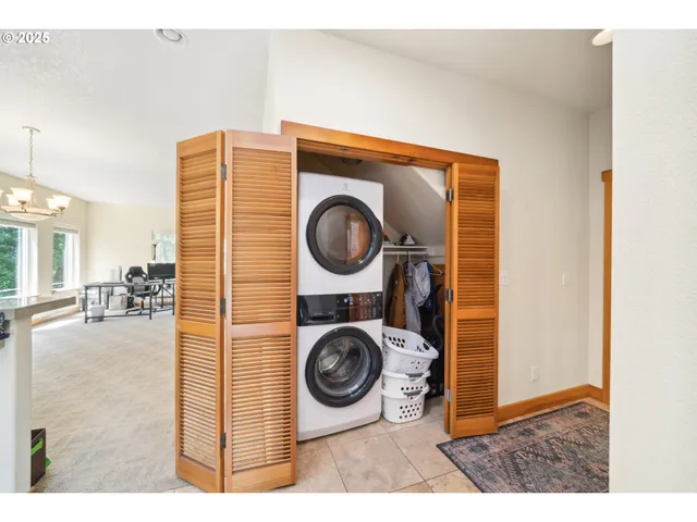a view of livingroom with washer and dryer