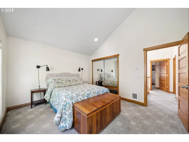 a bed room with a bed and a television