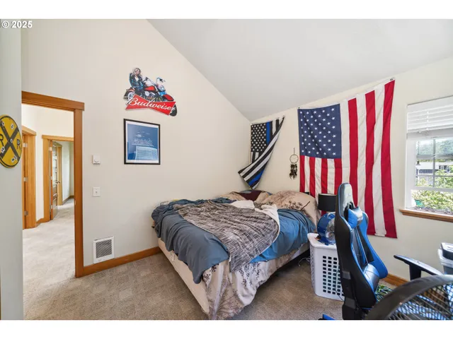 a bedroom with a bed and a bookshelf