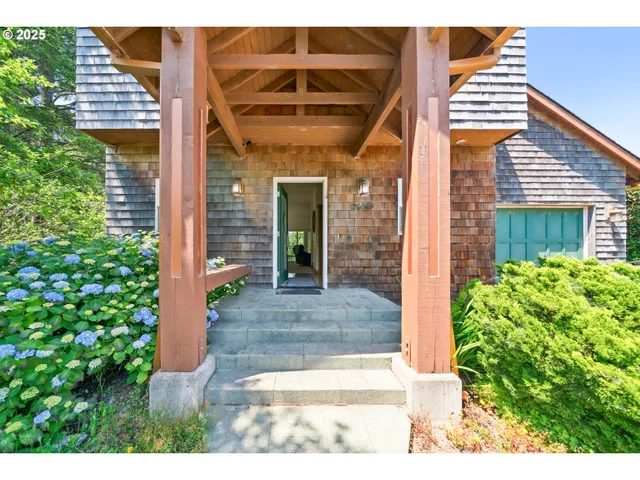 a view of a house with potted plants